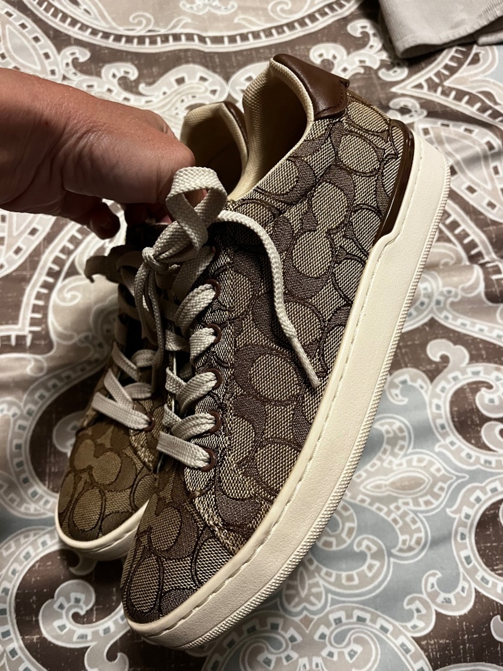 Coach tennis shoes.